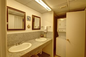 Updated bathroom w/ granite countertop. New washer/dryer! Door to shower/toilet.