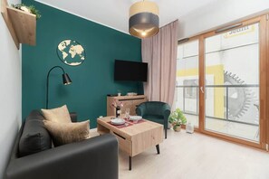 A comfortable sofa bed in the living area offering additional sleeping space for one guest.