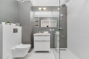 The bathroom's stylish design provides a relaxing environment. 