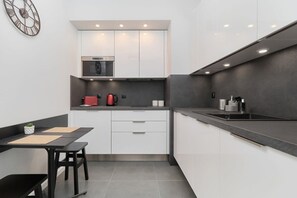 The fully equipped kitchen includes everything you need for a home-cooked meal.