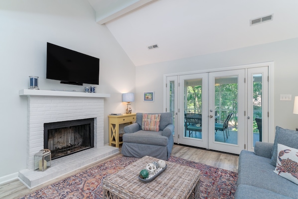 French doors off the great room lead out to the screen porch