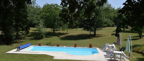 View of heated swimming pool and grounds.