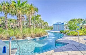 Lazy River Oasis: Glide into relaxation amidst palm trees and sparkling waters!