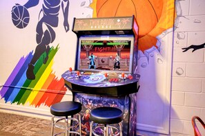 Game Room: Challenge friends with vintage arcade classics in a vibrant, playful atmosphere!