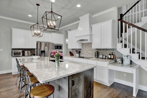 Beautiful kitchen with large island and top of the line appliances.