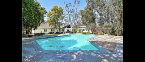 View from pool of main house and guest house