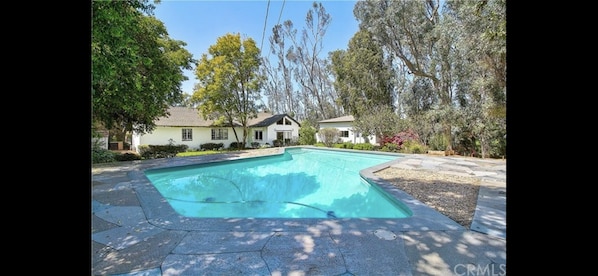 View from pool of main house and guest house