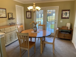 Dining area with rear deck beyond