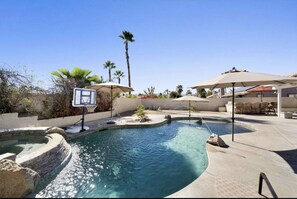 Private saltwater pool & spa with water features and mountain views.