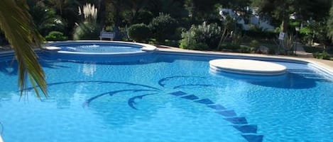Stunning communal pool set in tropical gardens