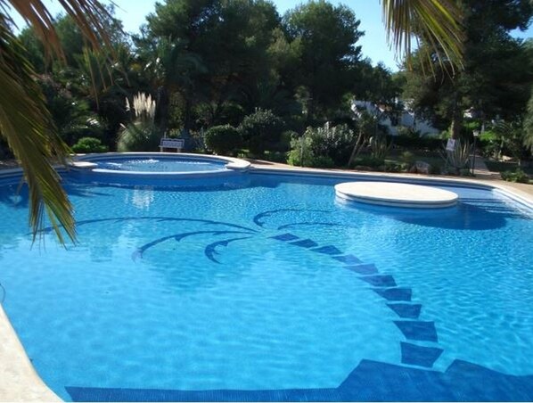 Stunning communal pool set in tropical gardens