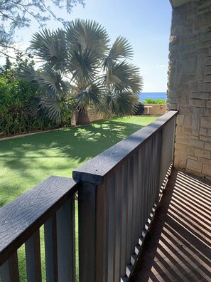 Condo patio, opens to grass area with communal BBQ