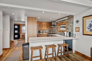 Kitchen with breakfast bar, open to the living area for entertaining