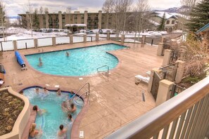 Outdoor heated pool and hot tub at the Spa at Storm Meadows