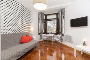 A comfortable sofa bed in the living area offering sleeping space for guests.