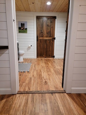 Doorway to bathroom. The is a small transition piece.