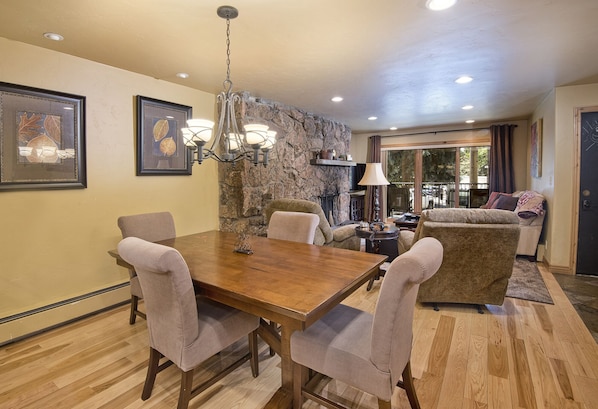 Dining/Living Room with fireplace and balcony