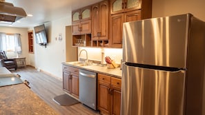 Kitchen - Main Level. Stocked kitchen with modern refrigerator, dishwasher and sink.
