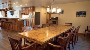 Dining Area - Main Level. Long wooden table and chairs for 10.