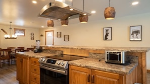 Kitchen - Main Level. Stocked kitchen with gas range and exhaust.