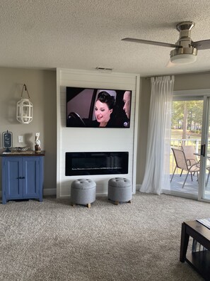 Open living room with build in fireplace.