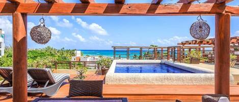 Private oceanview rooftop pool with loungers