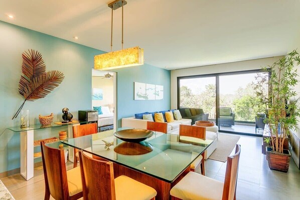 Gorgeous dining table for 6 and comfy living area that opens to your private balcony!