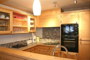 Prepare a meal in the equipped kitchen.