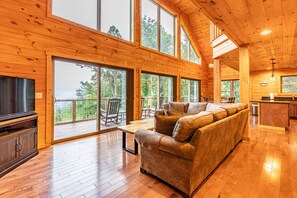 Livingroom with gas fireplace sectional couch and view of the mountains