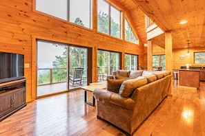 Livingroom with gas fireplace sectional couch and view of the mountains