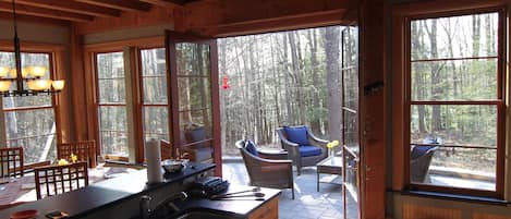 Kitchen flows on to outdoor patio, light filled, open views. 