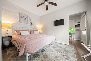 Bedroom with new king bed and smart tv.