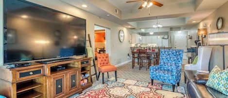 This cozy and serene space features an impressive 85" high-definition television, a comfortable leather recliner sofa, and ample seating options for the family. The TV offers access to popular streaming services such as Netflix, Disney, Hulu, etc.