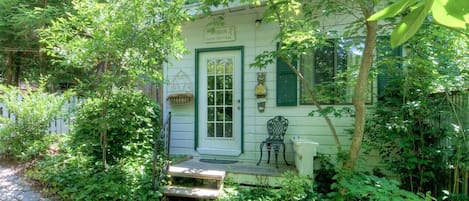 A quaint cottage surrounded by lush greenery