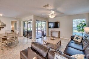 The newly furnished living room has plenty of seating for your entire family! 
