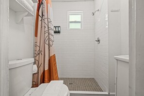Remodeled bathroom with large walk-in shower.