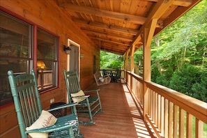 Enjoy the rocking chairs, swinging bench and game table on the front porch.