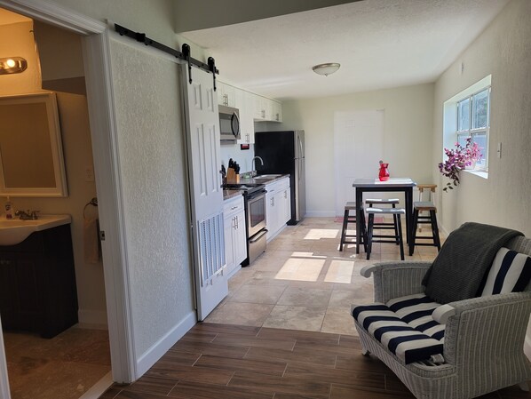 Kitchen area and bathroom. Full kitchen: oven, microwave, fridge, coffee maker. 