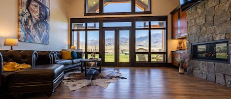 Living room. Leather cabinets& furniture, huge chandelier, 16 ft ceiling
