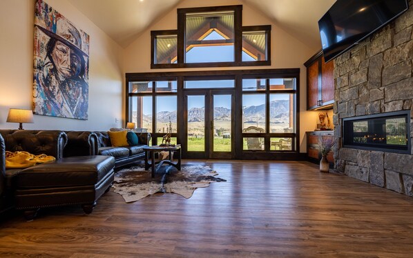 Living room. Leather cabinets& furniture, huge chandelier, 16 ft ceiling
