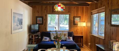 Our sweet little living room space with bistro table for coffee and meals.