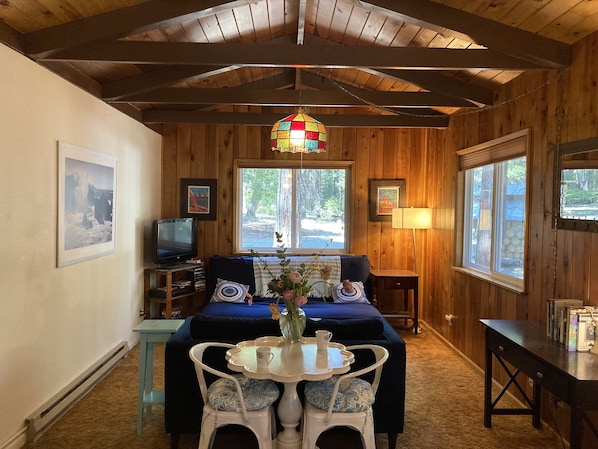 Our sweet little living room space with bistro table for coffee and meals.