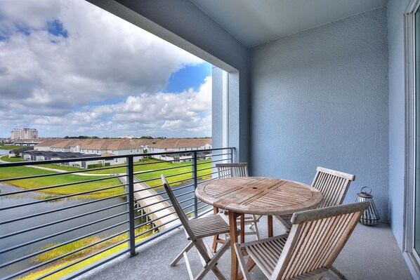 Balcony with wooden dining set perfect for al fresco dining