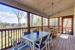 Enjoy dining alfresco in the screened in porch