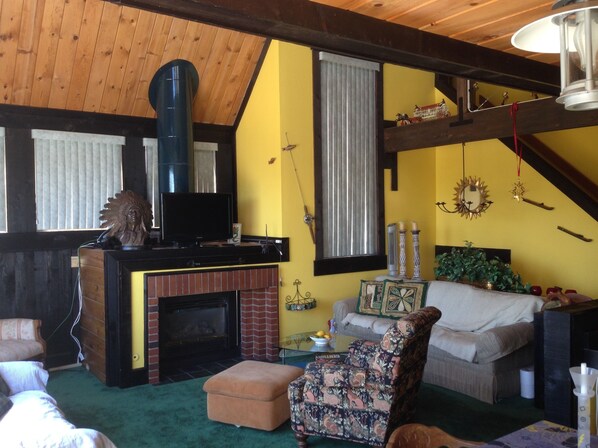 Great room with high ceilings and large windows. catch the sunrise every morning