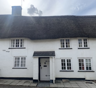 Delightful mid-row thatched cottage in beautiful sleepy Dorset village.