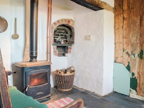 Warming and welcoming woodburner in the living room | Gamekeepers Cottage, Newchapel, near Cardigan