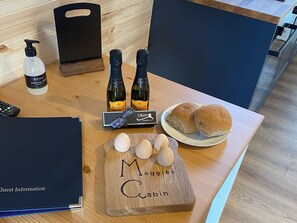 Locally Hand Made Chocolates from Oban Chocolate Co, 2 small bottles of Proseco, Mackies of Scotland Crisps, fresh free range eggs from our own Silkie Hens | Maggie’s Cabin, Oban