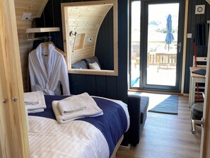 Customers can relax in comfort with the bath robes and slippers provided for their stay | Maggie’s Cabin, Oban