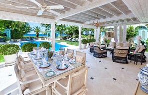 Large covered terrace with casual dining and living areas